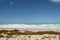 Nature landscape. Deserted beach on a tropical island. Moss on white sand on the beach