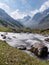 Nature landscape, flowing water in the river with mountains and forests in summer at Sonamarg, Jammu, and Kashmir, India