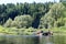 Nature landscape. Group of tourists rafting on a calm river on catamaran