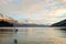 Nature landscape image of a gull flying across the lake with mountain