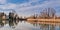 Nature landscape with lake, church and swan.