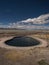 Nature landscape panorama view of outdoor swimming pool Termas de Polques hot springs Uyuni Potosi Sur Lipez Bolivia