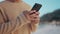 Nature, phone and closeup of hands typing a text message on social media, mobile app or website. Technology, online and