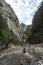 Nature photographer on mountain river in gorge