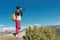 Nature Photographer taking pictures on his dslr camera outdoors during hiking trip on Caucasus. North Caucasus Russia