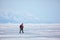 Nature photographer traveling on Baikal Lake in Siberia at winter time