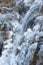 Nature power - close up of frozen natural mountain waterfall