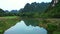 Nature, river and a bike driving on a bridge outdoor in the countryside for freedom, travel or transportation. Forest