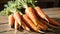 Nature\\\'s Bounty: A Radiant Display of Freshly Picked Carrots, Bathed in Studio Light, Gracing a Wooden Table