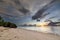 Nature\\\'s Canvas: Sunrise over Diani Beach with Majestic Rainy Clouds on the Horizon