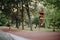 Nature& x27;s Fitness: Athletic Girls Jogging in the Green Park