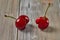 Nature's Oddity: ugly, irregularly shaped cherry stands out against a rustic wooden backdrop