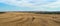 Nature scenery of the countryside near the ancient town of Matera Sassi di Matera with rounded hay packs on the dry field