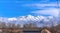 Nature scenery in winter of soaring frosty mountain against blue sky and clouds