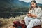 Nature, smile and woman on a phone for hiking on a mountain and network on social media or mobile app. Happy, technology