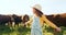 Nature, summer and girl in field with cows, happy dairy farmer on grass. Sustainability, farming and freedom, child with