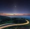 Nature sunrise background amazing curve road and zodiacal light star night sky twilight color long exposure . Popular travel