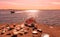 Nature sunset background Romantic beautiful sunset afternoon at sea on horizon Baltic Sea boat coral seashell on the rock sea sky