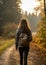 Nature Walk: An invigorating capture of someone enjoying a brisk morning walk autumn forest, harnessing the outdoors to