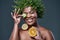 Nature Where beauty began and never ended. a woman wearing a leaf wreath while holding cucumber, lemon and an orange