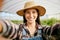 Nature is where she is most at peace. Shot of a young female farmer taking selfies.