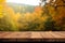 Natures embrace, Wooden table against an autumn forest backdrop