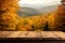 Natures embrace, Wooden table against an autumn forest backdrop