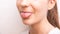 naughty lower part of teen girl face showing tongue over white background