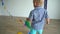 Naughty toddler boy playing with colorful flags. Gimbal motion