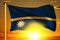 Nauru flag weaving on the beautiful orange sunset with clouds background