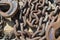 Nautical chain links and clips rusted and weathered textured metal resting on a seaside dock detail