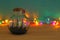 nautical concept image with sail boat in the bottle and multicolor garland lights over wooden table. Selective focus.