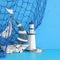 nautical concept with white decorative sail boat, lighthouse, seashells and fishnet over blue wooden table and background.
