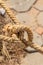 Nautical knot, old mooring rope weathered and close closeup