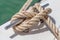 Nautical knot rope tied around stake on boat or ship