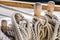 Nautical knotted ropes on wood cleats of old sailboat