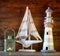 Nautical lifestyle concept. old vintage lighthouse, sailing boat and lantern