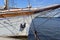 Nautical maritime scene with ropes and mast on a ship on a dock by the water