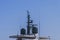 Nautical radio radar and antena at luxury yacht docked at marina