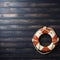 Nautical themed welcome Lifebuoy on textured wood background for custom text