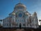 Naval cathedral of Saint Nicholas in Kronstadt, view from the main entrance, the temple is illuminated by the setting sun