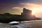 Naval submarine at sea during sunset