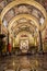 Nave and tombstones with altar in background in Valletta Cathedral, Malta