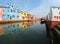 Navigable canal and the houses in Burano Island near Venice in I