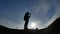 Navigation travel silhouette concept. Man hiker traveler checking smartphone sunshine sunset the gps navigator hiking in