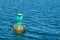 Navigational buoy anchored at the netrance of a harbour
