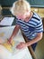 Navigational duty officer insert the position into the sea chart