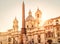 Navona Square in sunlight, Rome, Italy. Sant`Agnese church and Four Rivers fountain with Egyptian obelisk. Piazza Navona is famou