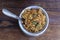 Navratan saffron biryani in metal pot on wooden background, top view, close up. Indian cuisine