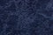 Navy blue background from a soft upholstery textile material, closeup.